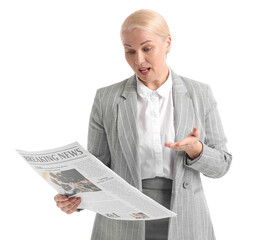 Surprised mature businesswoman with newspaper on white background