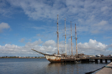 Argus, Historic Cod fishing vessel in Portugal before its revitalization. In the background, partial view of the city of Aveiro, Gafanha da Nazar&eacute;, Portugal 30 August 2021.