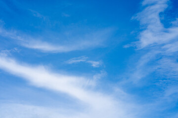 Naklejka na ściany i meble Abstract beautiful clouds scape against light blue sky background.