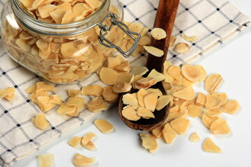 Dried garlic flakes on white background. Dried vegetables