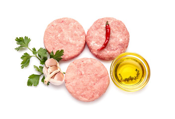 Composition with raw cutlets made of fresh forcemeat on white background