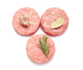 Composition with raw cutlets made of fresh forcemeat on white background