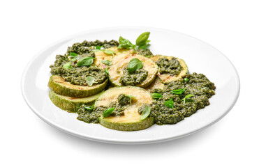 Plate with tasty grilled zucchini and pesto sauce on white background