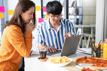 group of business people talking about project and prepare pizza and potato chips for having lunch in corporate together in office.