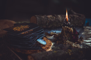 Candle burns on the altar, magic among candles, clean negative energy, wicca concept - obrazy, fototapety, plakaty