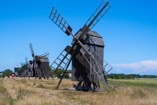 A line of old windmills on a plain. Picture from the Baltic Sea island of Oland