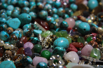 Collection of various colorful pearls. Stunning beads crystals rhinestone. Texture colored beads of different shapes. Multicolored Full frame