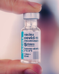 hand holding a bottle of medicine