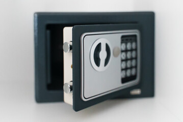Black small home or hotel safe with keypad.