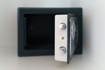Black small home or hotel safe with keypad.