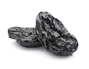 Tasty prunes on white background