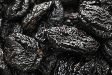 Tasty prunes as background, closeup