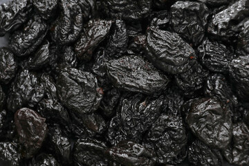 Tasty prunes as background, closeup