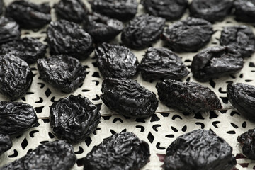 Tasty prunes on table, closeup