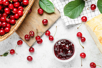 Ripe cherry and jam on light background