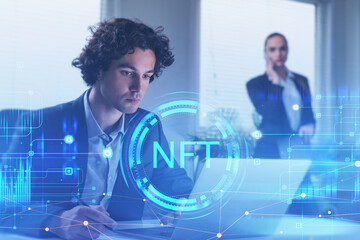 Handsome Hispanic businessman working on laptop in office, non-fungible token hologram, nft with network circuit and globe. Concept of crypto art and technology