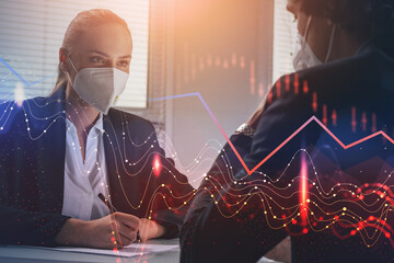 Communication of two business people in face protective masks in office space, hologram of decreasing financial chart. Economic crisis because of corona virus or covid-19