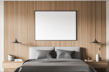 Banner with wall panelling, pendant lamps and grey bed. Close-up view.