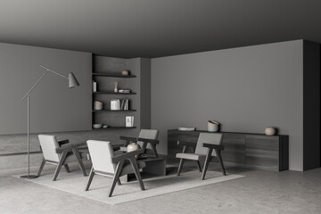 Dark grey-hued living room with armchairs and slim lamp