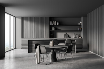 Dark grey kitchen space with round dining table