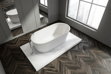 Top of minimalist grey design of bathroom interior with platform tub