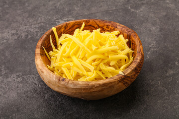 Shredded yellow cheese in the bowl