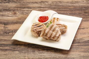 Grilled pork tenderlion with tomato sauce