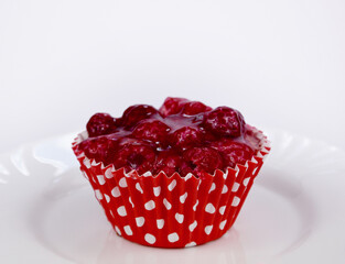 Delicious juicy raspberry tartlet with raspberries and jelly topping stock images. Creamy red...