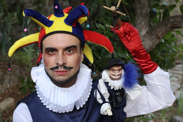 Medieval buffoon with a puppet