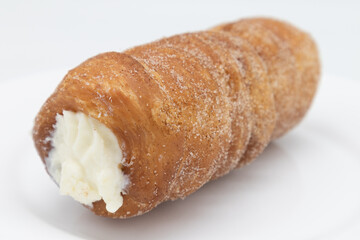 Large Cannoli Donut with a White Background
