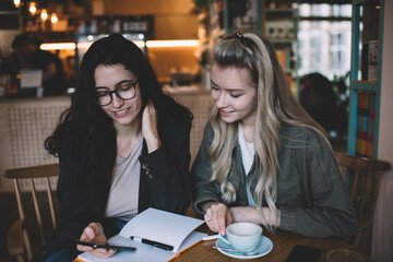 Young colleagues having coffee break together