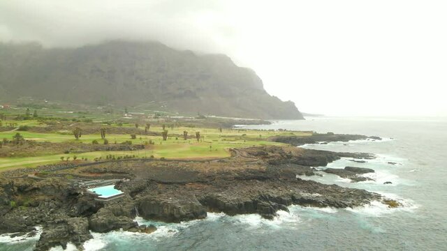 Tenerife, Buenavista del Nte. a town on the Atlantic Ocean. Sunny coast and golf course and banana plantation. Ocean, water, waves, blue ocean.