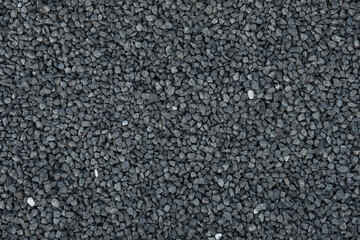 Close-up of crushed stone, granite gravel. Rough geometric seamless pattern and background of building material. - obrazy, fototapety, plakaty