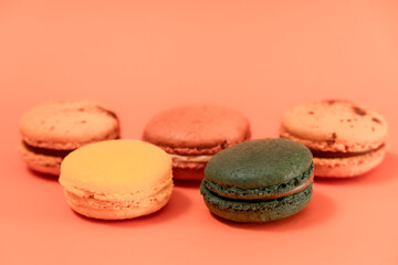 Close up of macaroons on an orange background