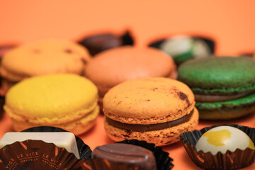 Close up of macaroons on an orange background