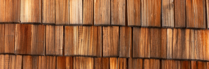 Wooden panoramic background. Brown and weathered wood shingles