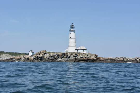 Rocky Ledge With Boston Light In The Harbor
