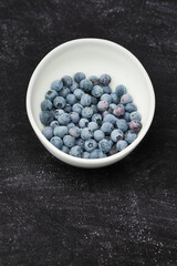 White Bowl of fresh wild blueberries
