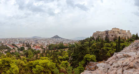 Panorama on Acropolis (Parthenon), mount Lycabettus and Athens old city center architecture in...