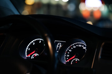 Closeup view of dashboard with speedometer and tachometer in modern car