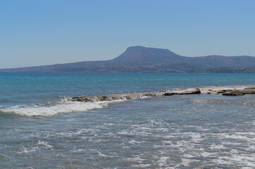 Sea and waves view with mountain in the background