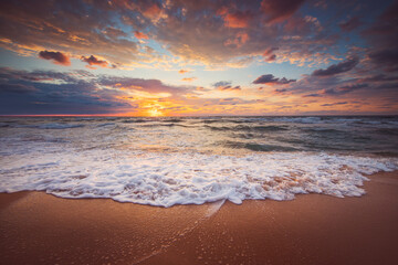Beautiful sunrise over the sea and tropical beach, paradise island and waves