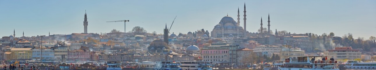 Obraz premium Istanbul, Turkey - 1 April, 2017: Panorama of Cityscape of Golden horn with ancient and modern buildings