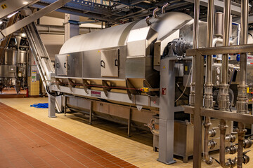 grape pressing equipment in a winery