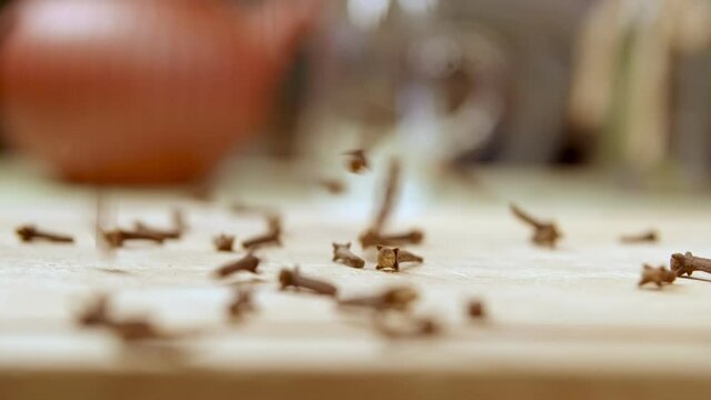 Cinnamon sticks falling into table. Close up tea cup. tea time 