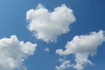 Obraz na płótnie Canvas Blue sky with fluffy heart shape cloud, natural background