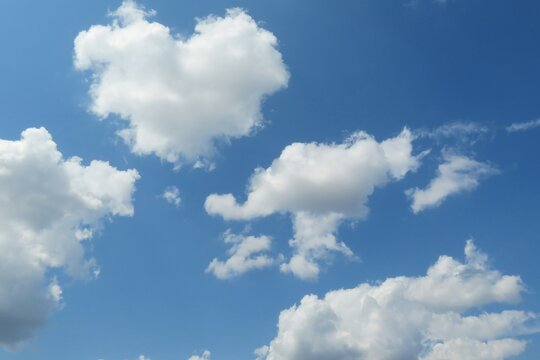 Beautiful heart shape cloud in blue sky, natural clouds background 