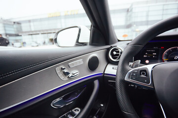 Obraz na płótnie Canvas Control buttons on steering wheel. Car interior.