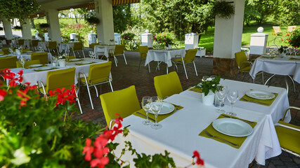 terrace summer cafe with tables and chairs for people, an empty institution for recreation, nobody