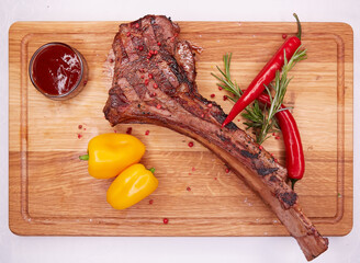 The Barbecue Tomahawk Steak on Cutting Board